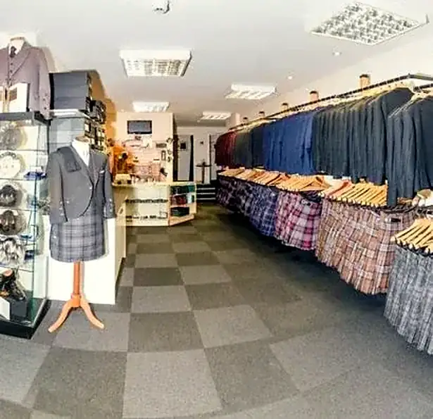 Inside the shop: racks of kilts and jackets